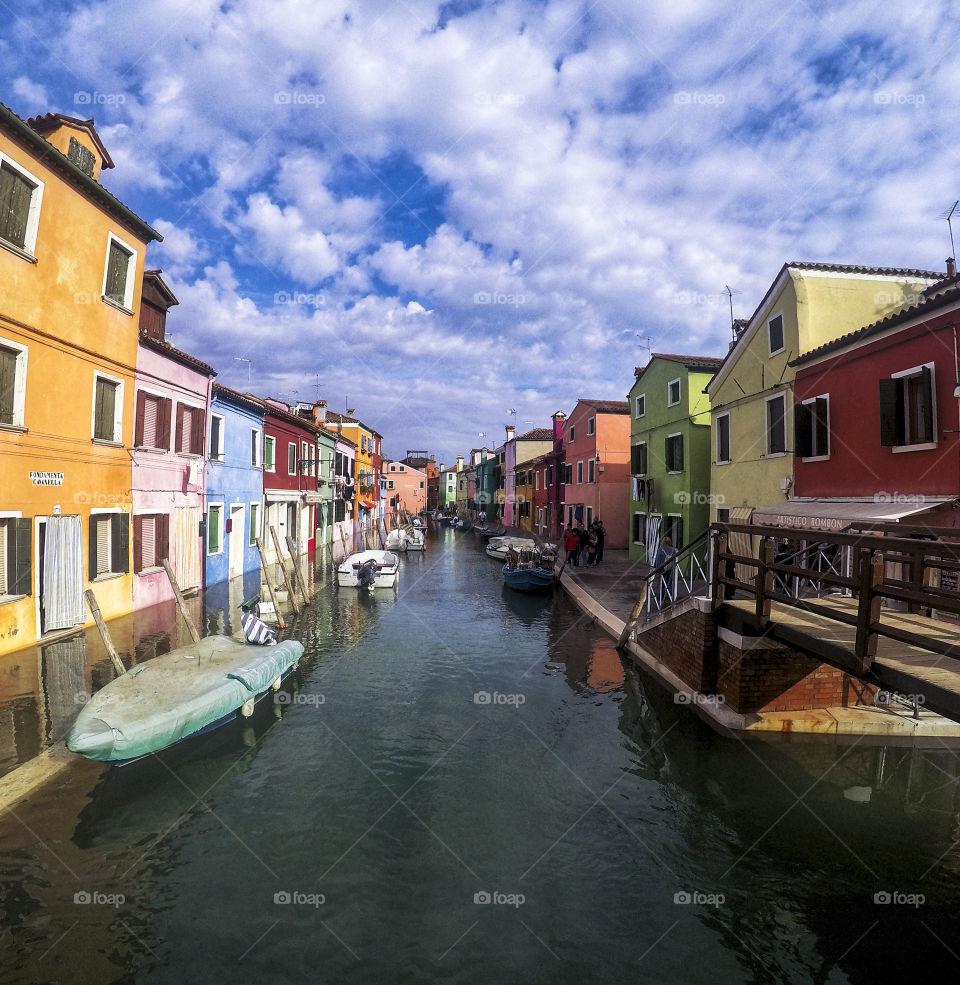 Bright, colorful, Italian homes with canal 
