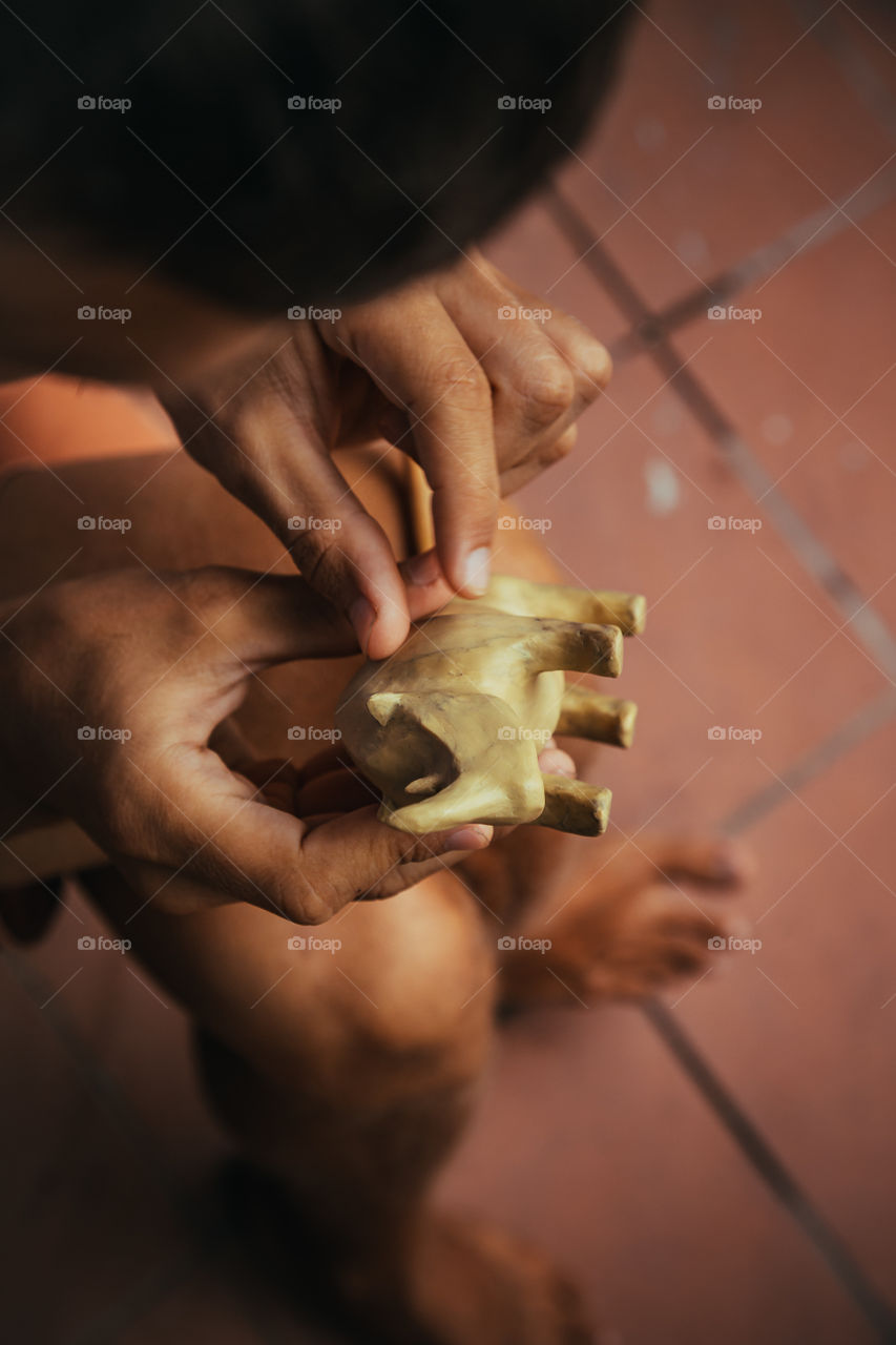 sculpture of rhino made of plasticine.