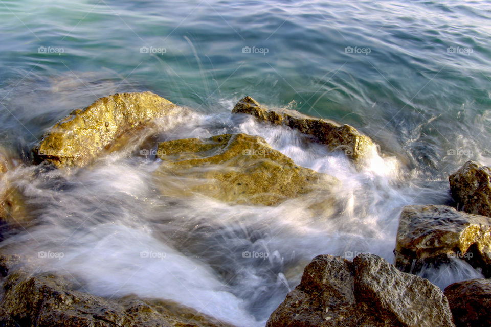 Waves over rocks