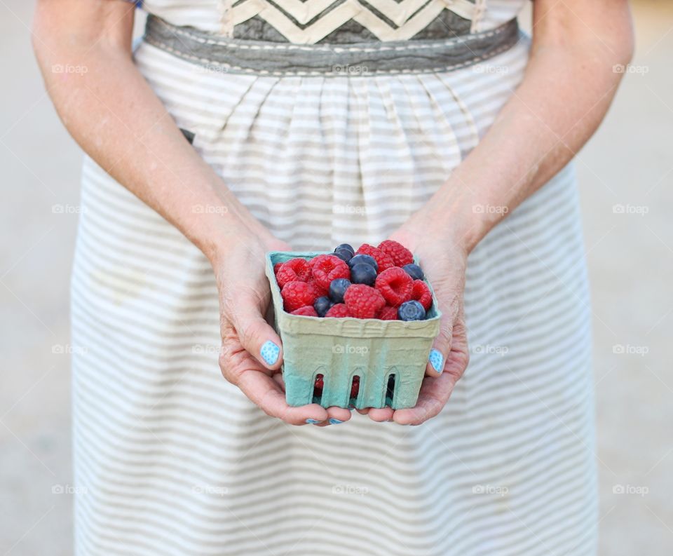 Close-up of a woman hand holding berries