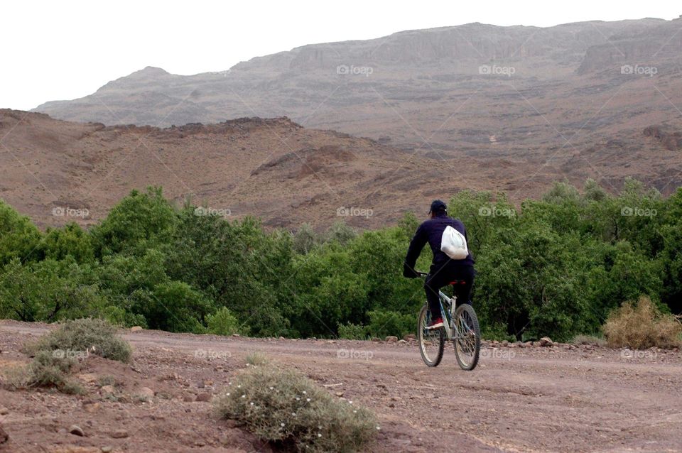 Cycling trip through the mountain road on a hard track