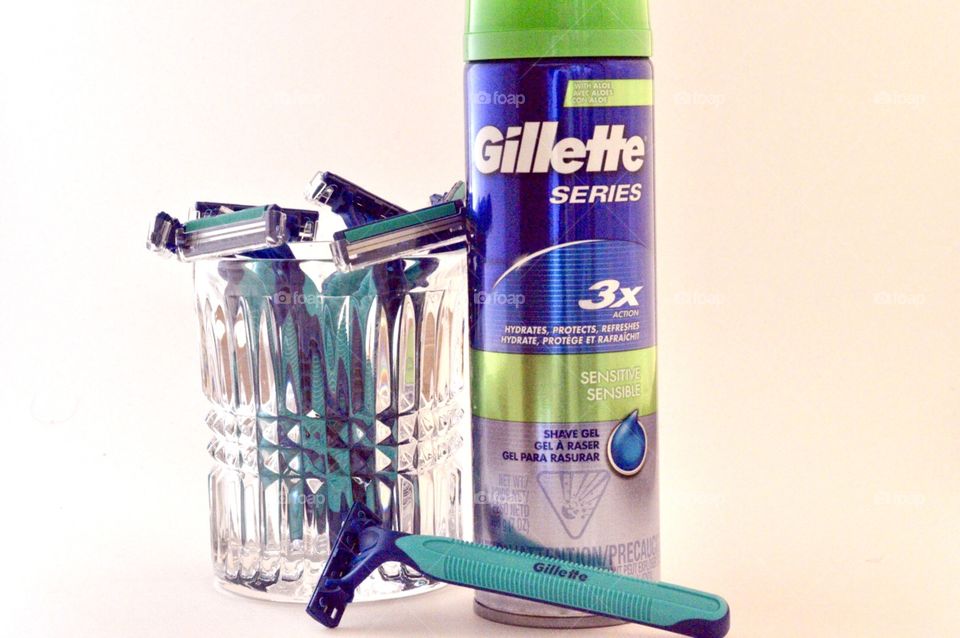 Gillette disposable razors and Gillett series 3X shave cream on a marble background 