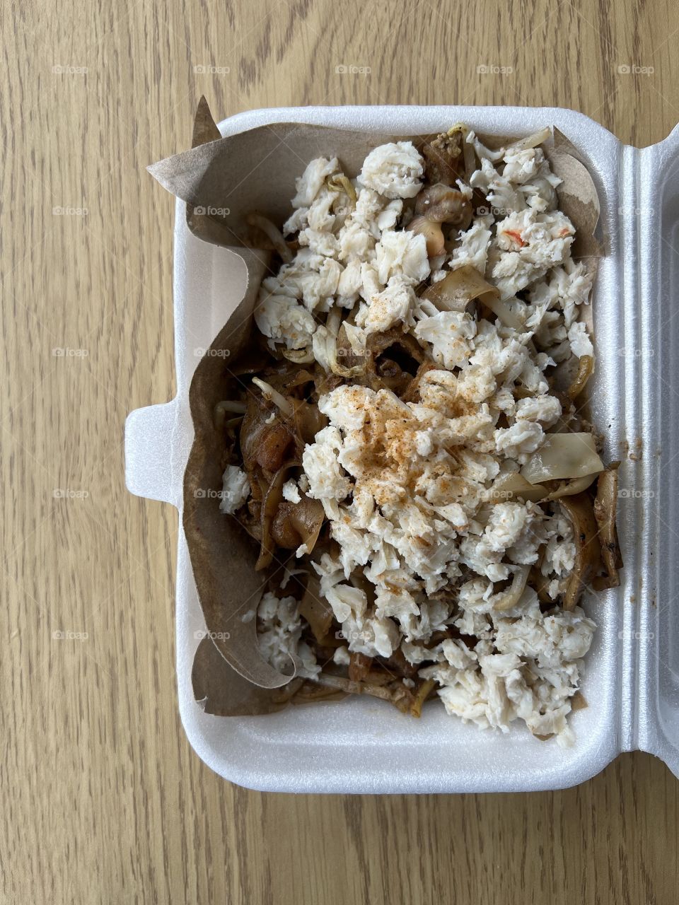 Local hawker asian dishes in cheesy floss carrot cake, crab meat char kway teow and fried rice with chicken and egg