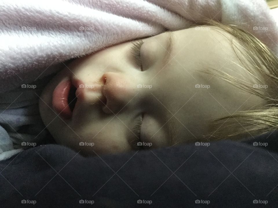 Baby with Down syndrome, sleeping, closeup