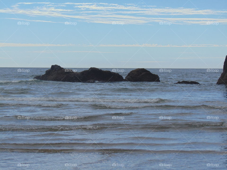 ocean rocks waves sky