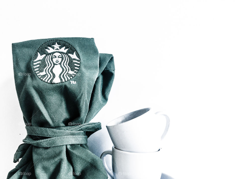 Classic Starbucks green apron with siren logo emphasized