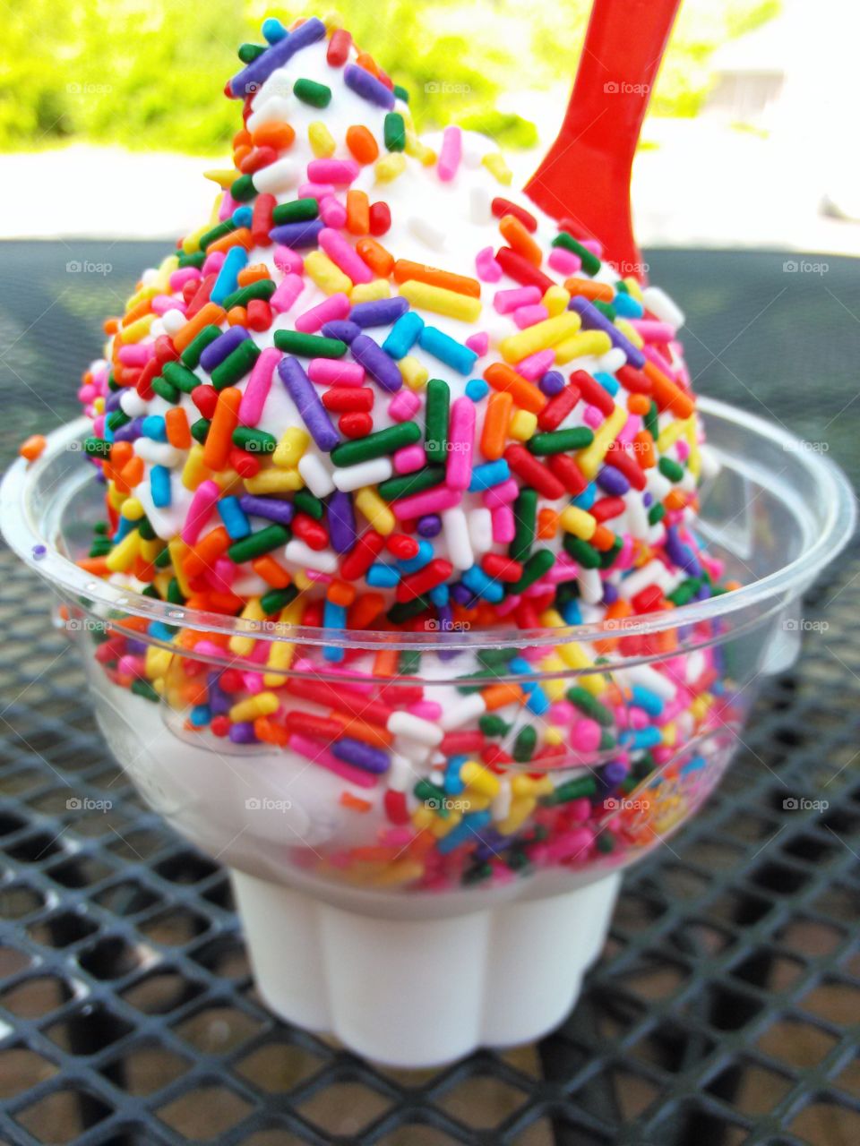 Yum. vanilla soft serve ice cream with sprinkles