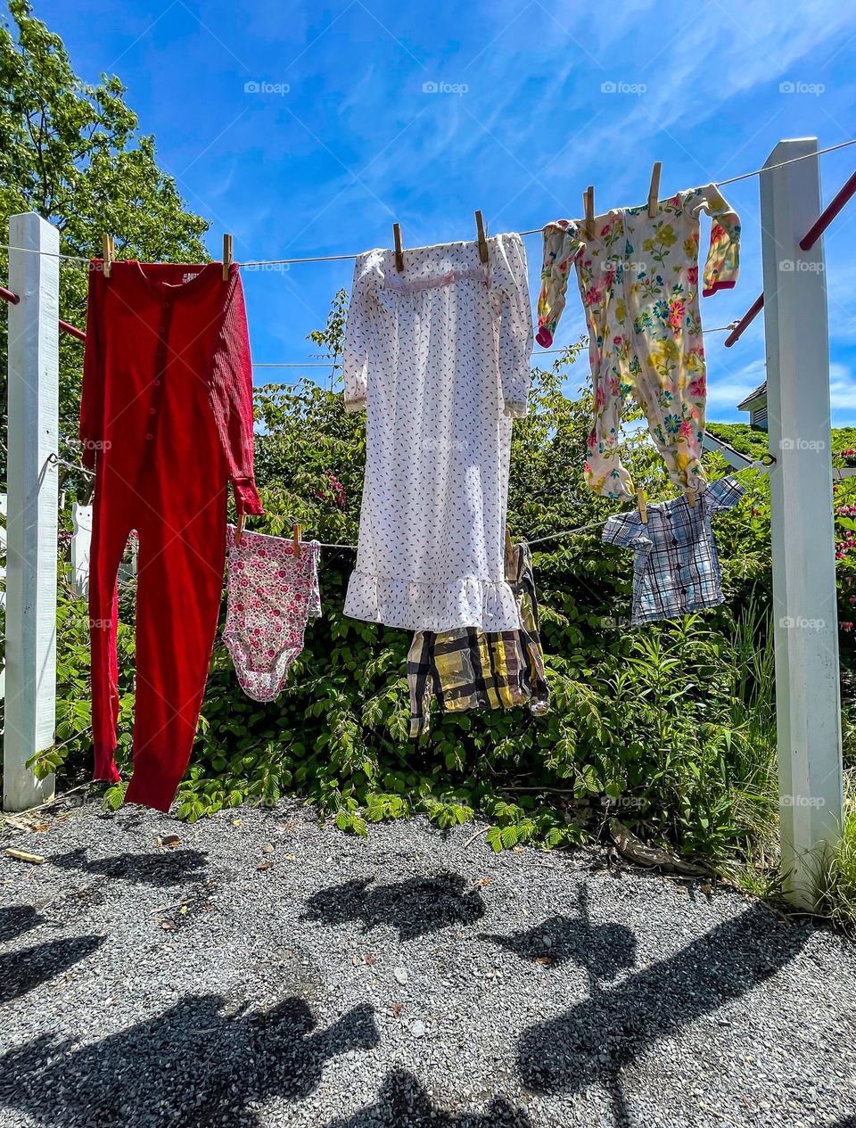 Laundry Line.  A myriad of colored garments hang from a clothesline.