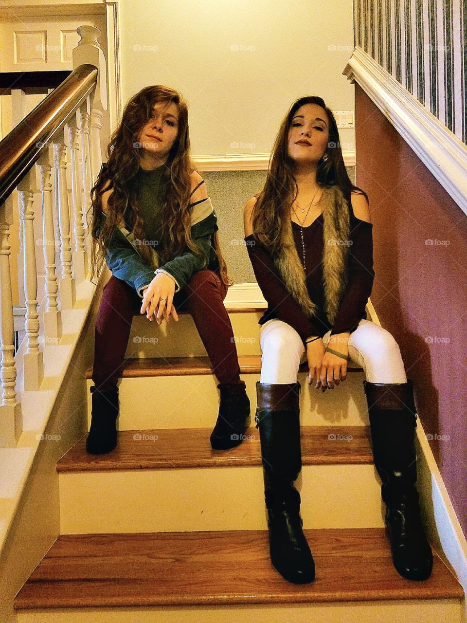 girls posing on a staircase