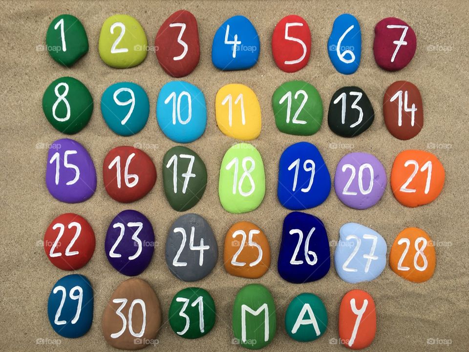 May calendar on colored stones 