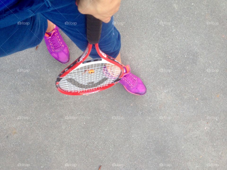 A girl holding a tennis racket