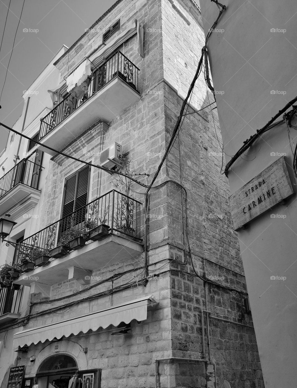 Architecture photography of a building in black and white /beautiful streets and buildings in Old Towns and cities, balconies and flowers