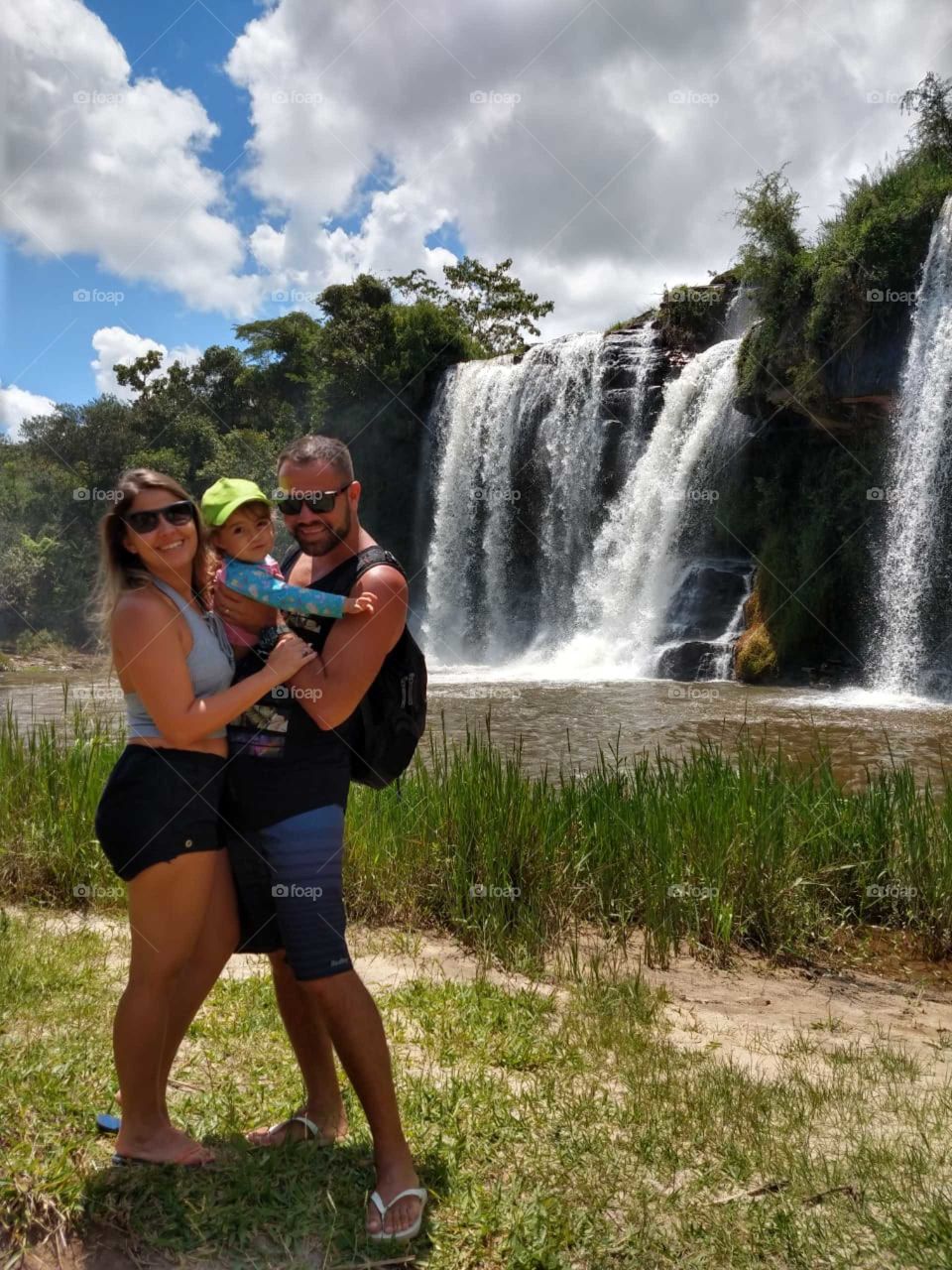 happy family in the nature.  amazing place. amazing Brazilian waterfall.  we love green.  live to Life.