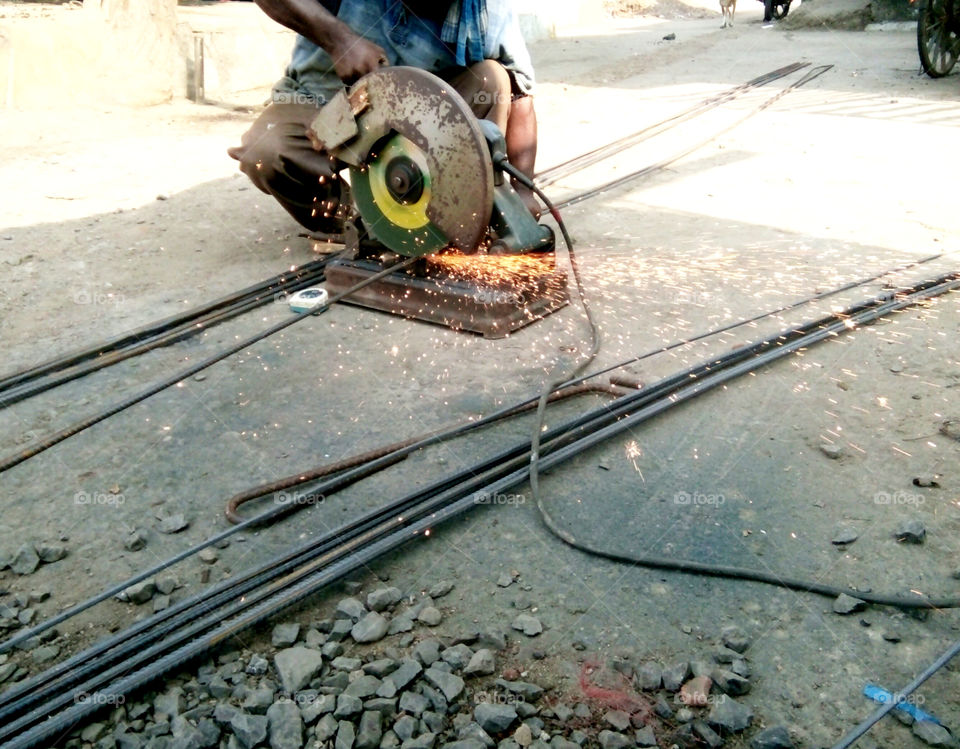 Photos of iron cutting machine,photos of cutting machine,photos of iron cutting work,photos in progress, photos of iron cutting work,a great picture of true hard work,photos of iron work,real and natural iron work photo,cutter machine photo