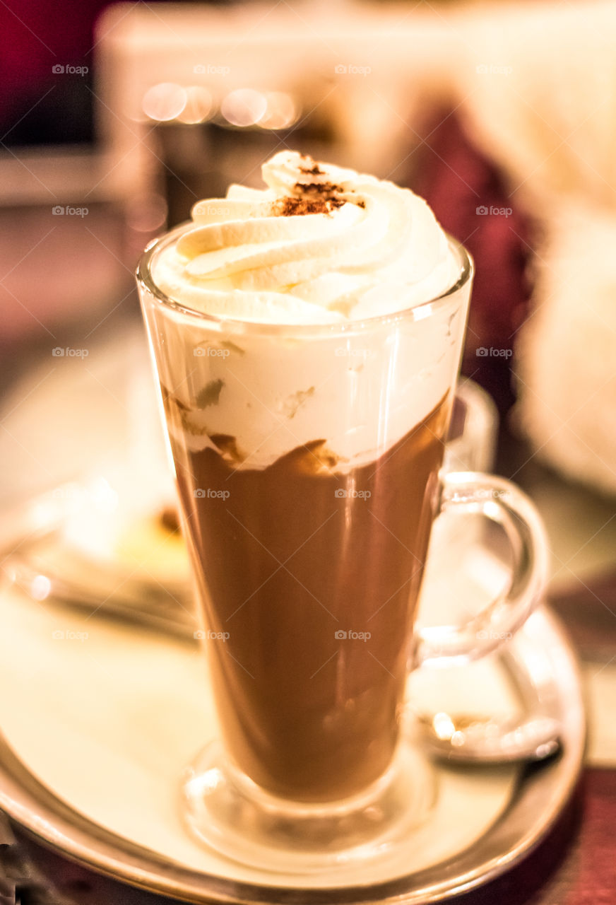 Coffee with whipped cream in glass