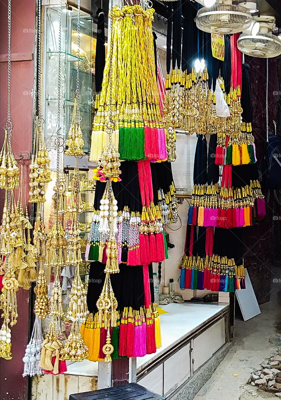 "​Paranda" is also known as parandi, is a women's hair ornament made of multicolored silk threads and decorated with floral (bunches) designs and ornamental tassels. The Pranda is a part of ethnic Punjabi clothing in India.