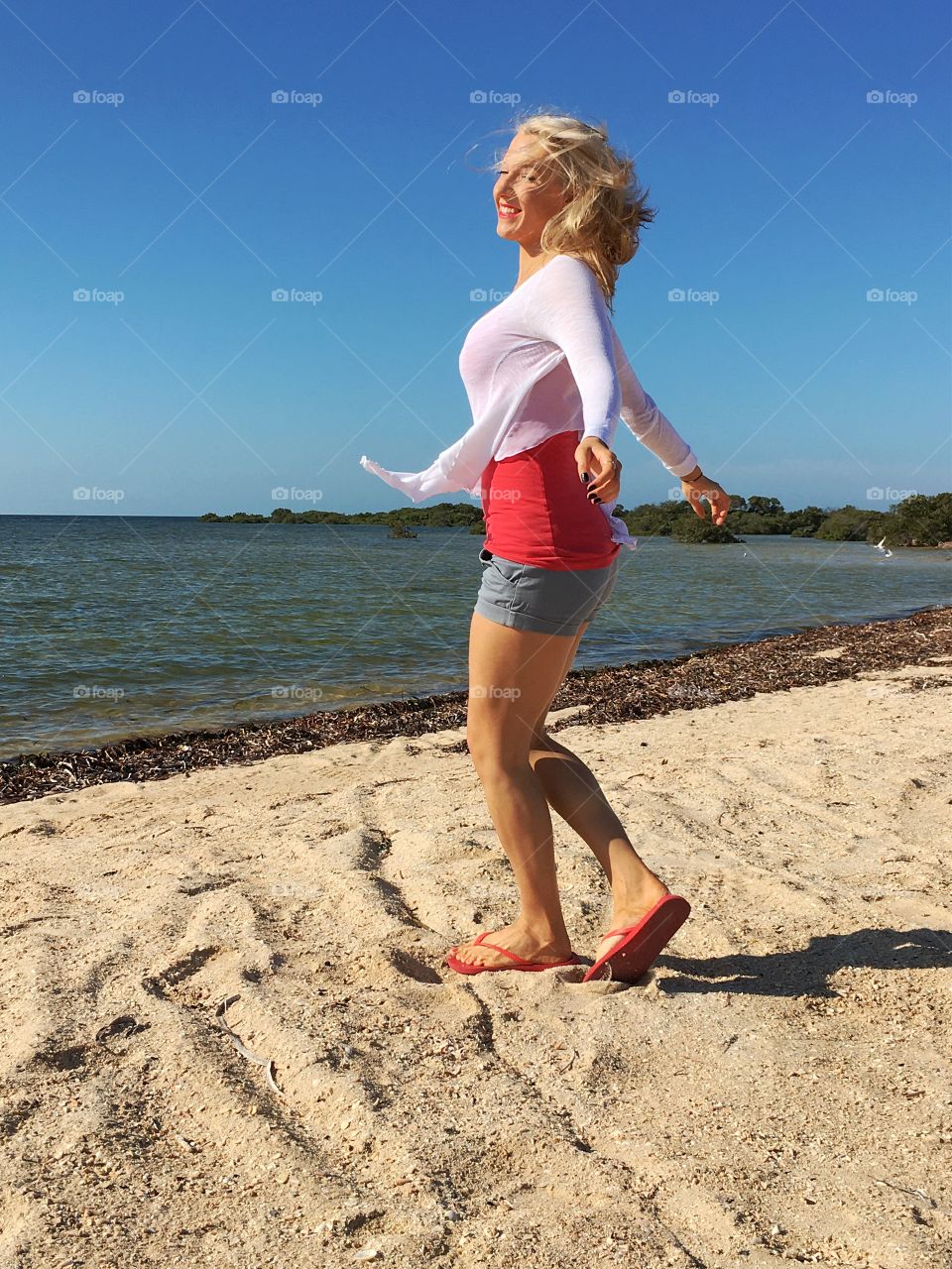 Girl dancing on beach
