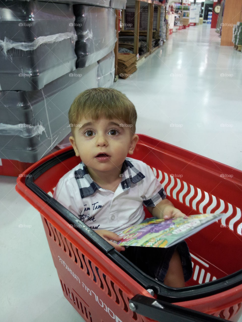 shoping center. A child asks to buy a book