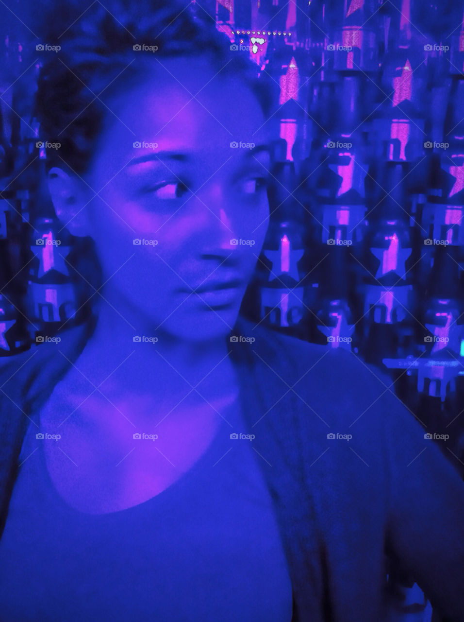 A beautiful woman posing in a night club.