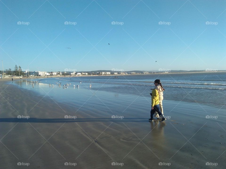 Two people in a trip near the beach at essaouira City in Morocco.