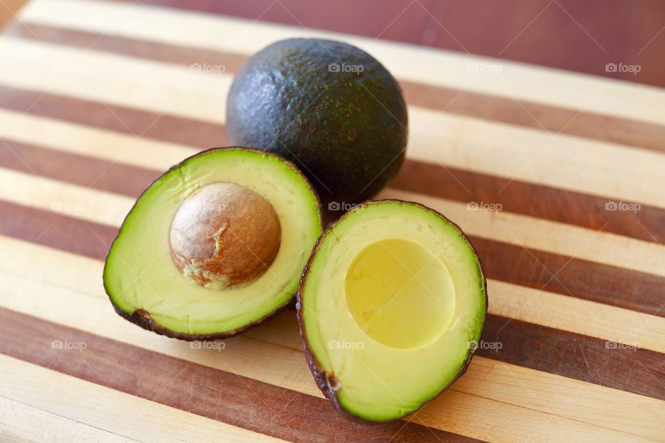 Avocados on a cutting board for a healthy snack. 