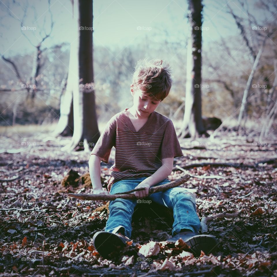 In the woods. Leave a child alone and they will make up their own fun and games in nature