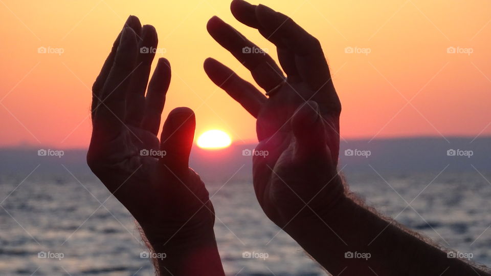 Hands sunset. Sunset on Hands