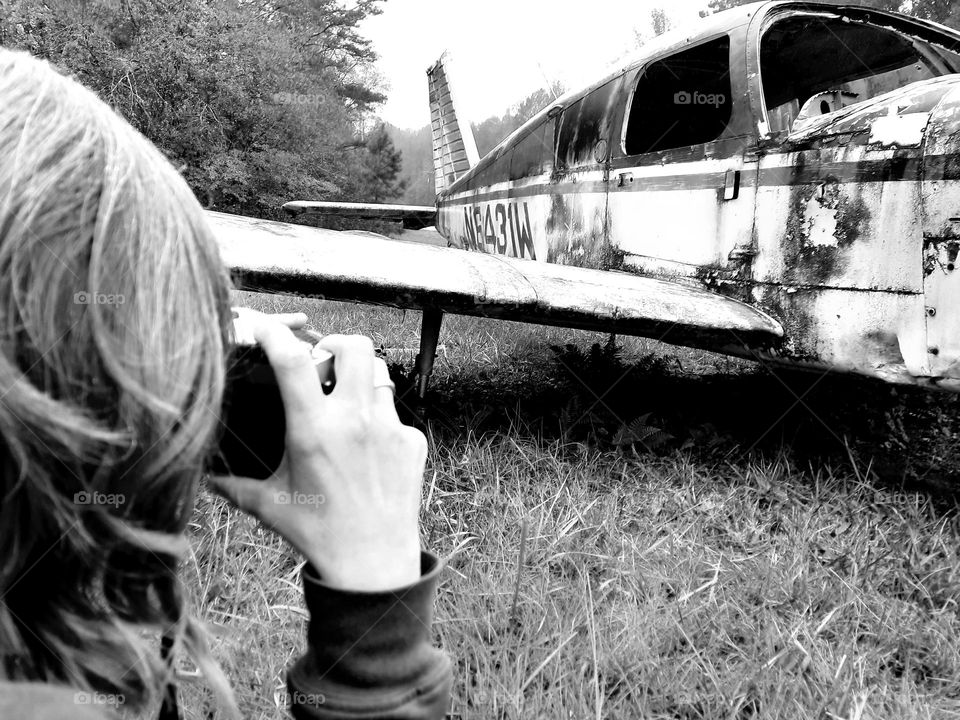 abandoned airplane in black and white