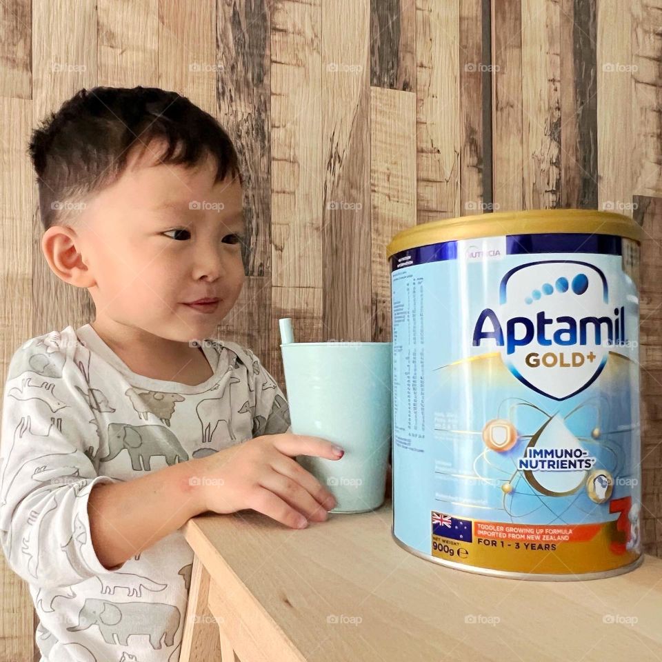 Happy boy with his favourite growing up milk formula 
