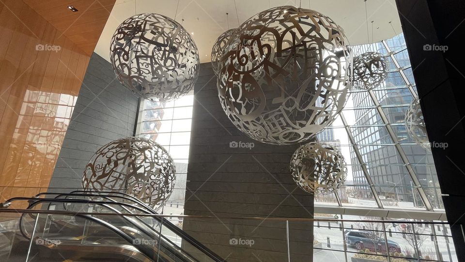The Spheres (Voices) are large- scale sculptures by Jaume Plensa located at the Hudson Yards in NYC. It consists of letters from eight different alphabets to inspire ideas from different cultures. 
