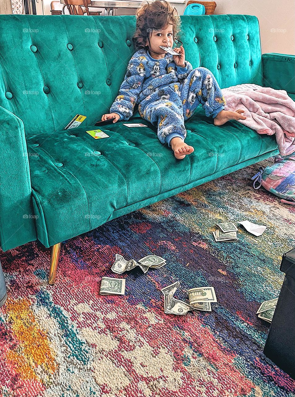 Toddler girl on green velvet couch, favorite spot at home, relaxing at home, what is happening in this picture, toddler girl gone wild, toddler girl tears apart mothers wallet, hilarious toddler picture