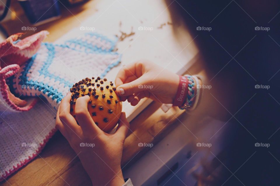 We are doing Christmas ornaments with oranges and carnations spices and my crochet work is on the table 