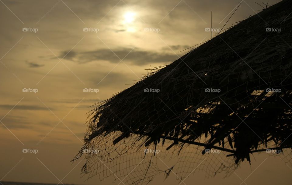 Thatched roof against sky