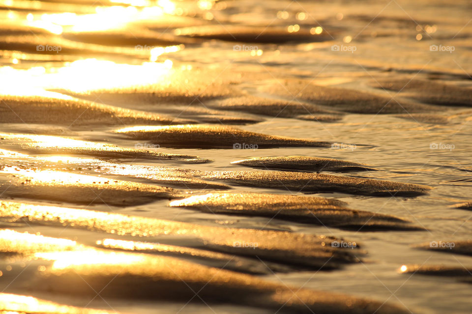 View of sunlight falling on sand