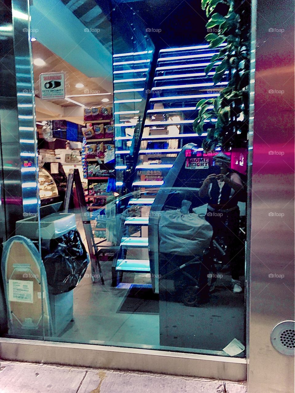 Reflection of myself taking this picture in a shop window with aluminum blinds somewhere in Long Island City, Queens, New York photographed in the summer of 2020. Hypnotic Productions
