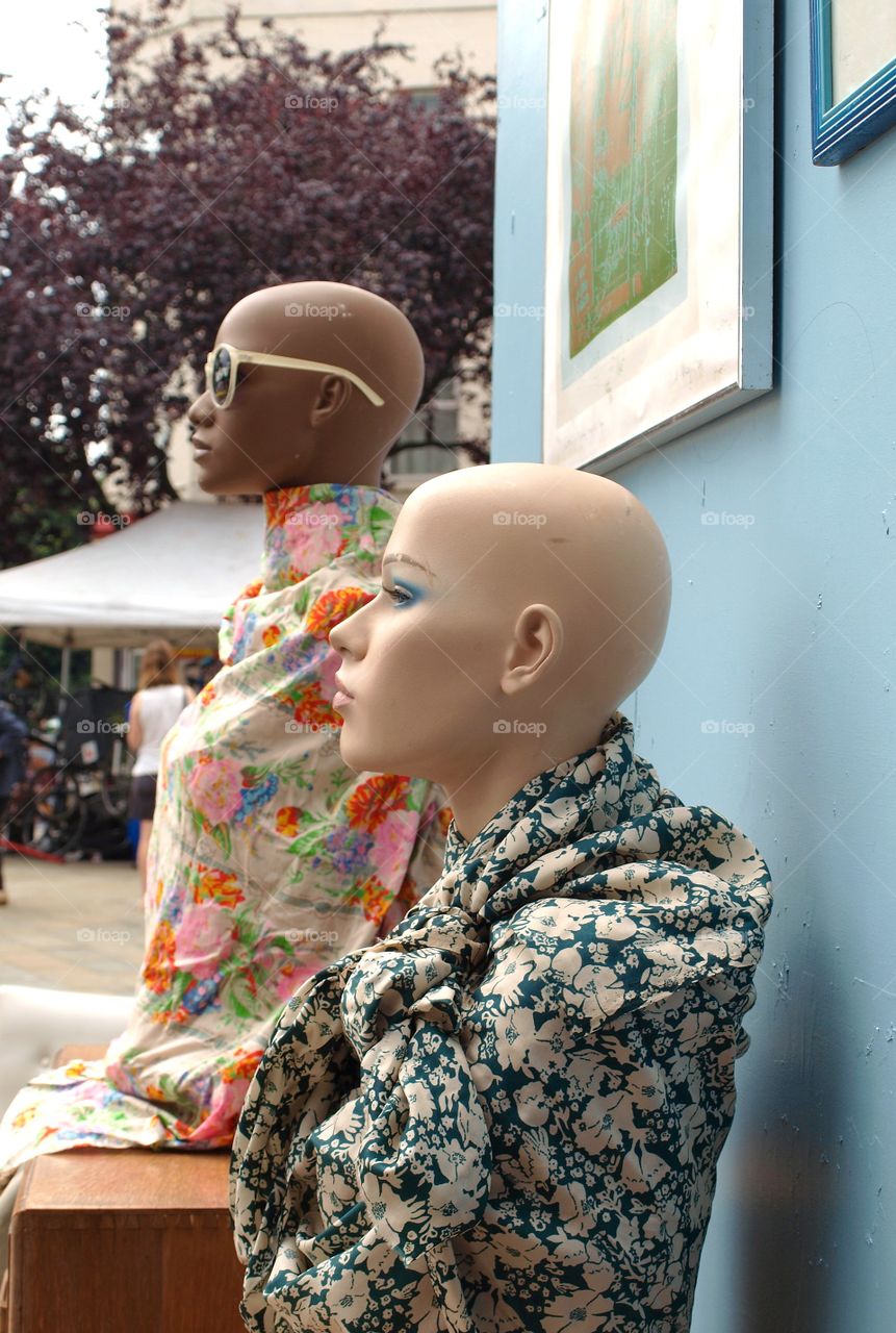 Two cool mannequins modelling colourful scarves 