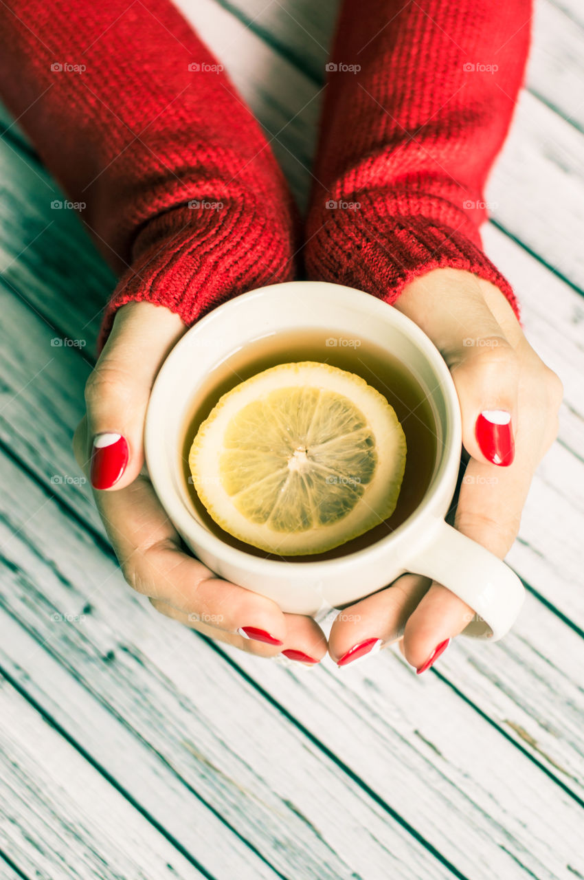 woman hand with cup of tea