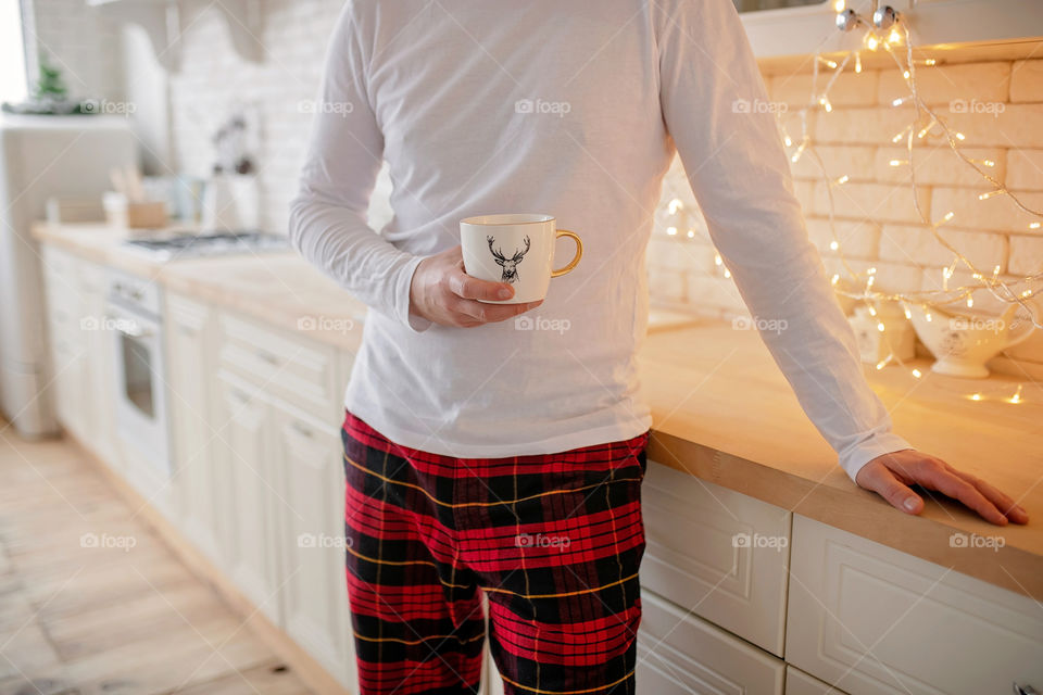 cup of coffee in a cozy festive Christmas atmosphere