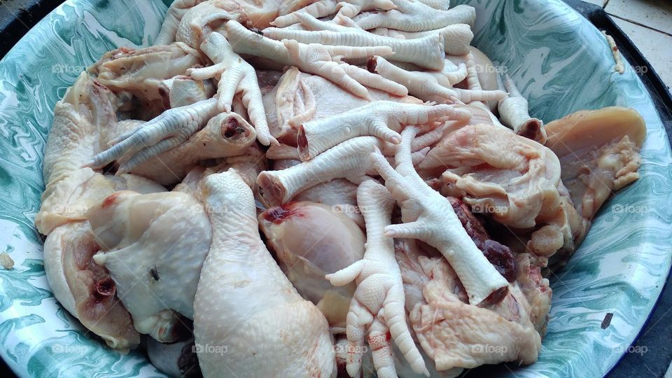 Chicken pieces that are ready to be processed for cooking