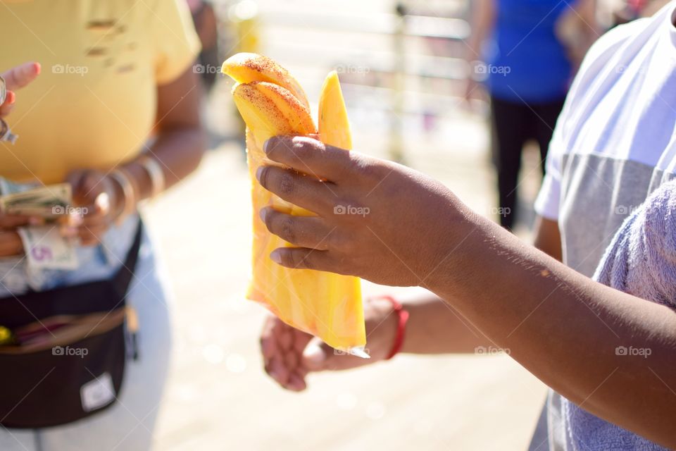 Freshly cut mango with lemon and chile 