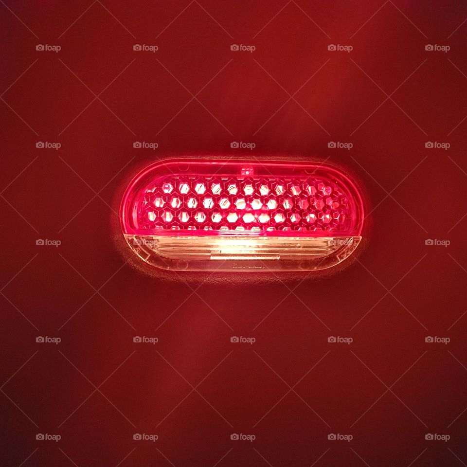 Car light from inside the car. Driver's side in the door from below.