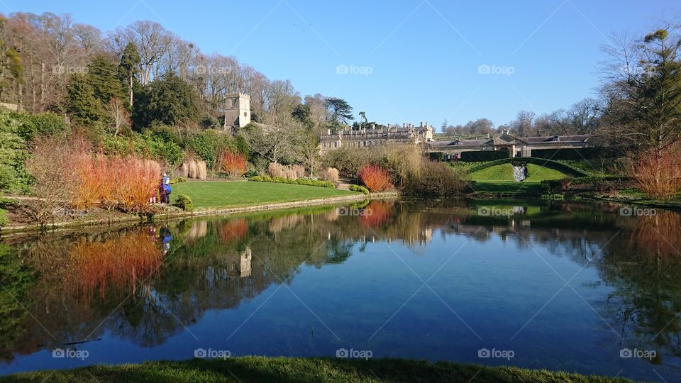 Dyrham Park formal water garden pond lake blue sky with reflection