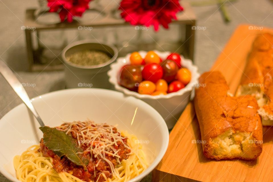 Spaghetti bolognese with basil leaf