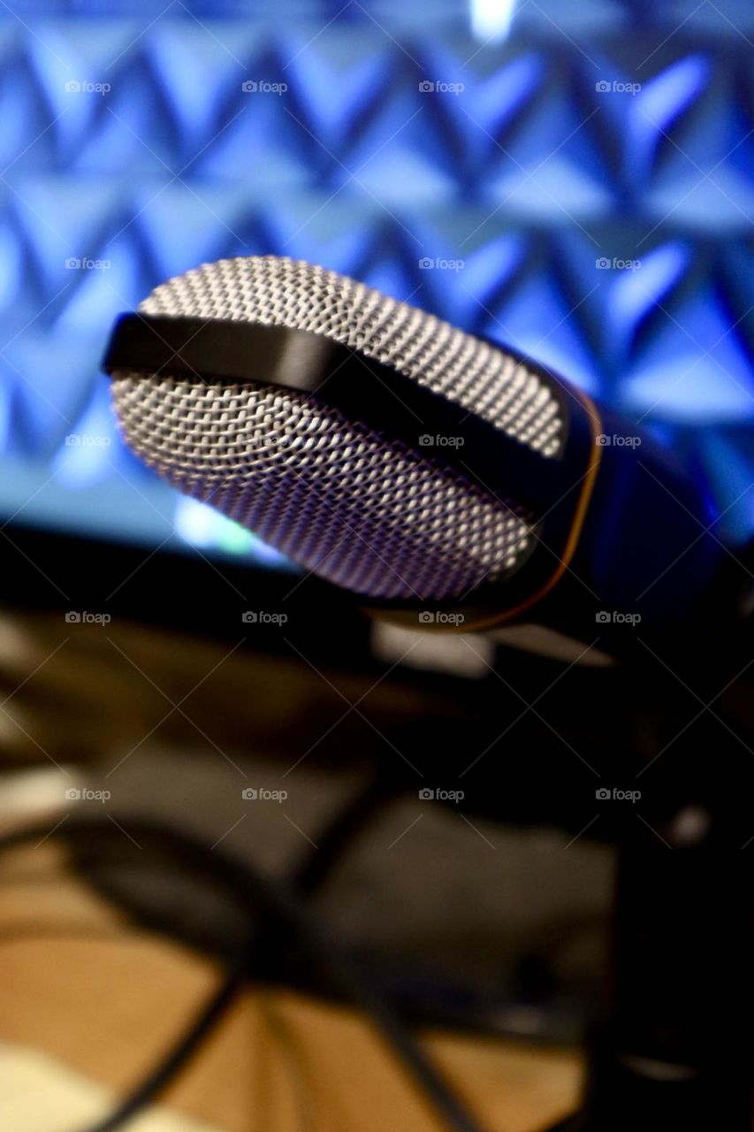 Microphone on blue screen background 