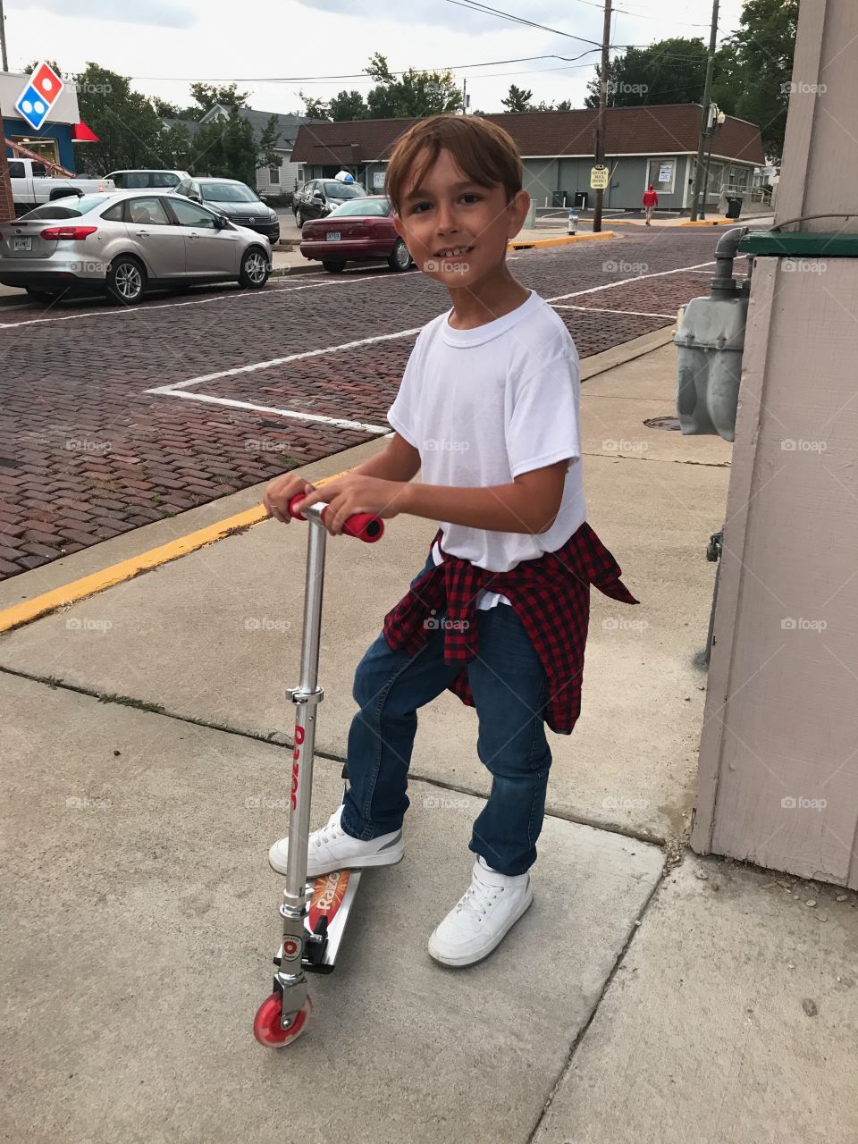 Boy in a scooter