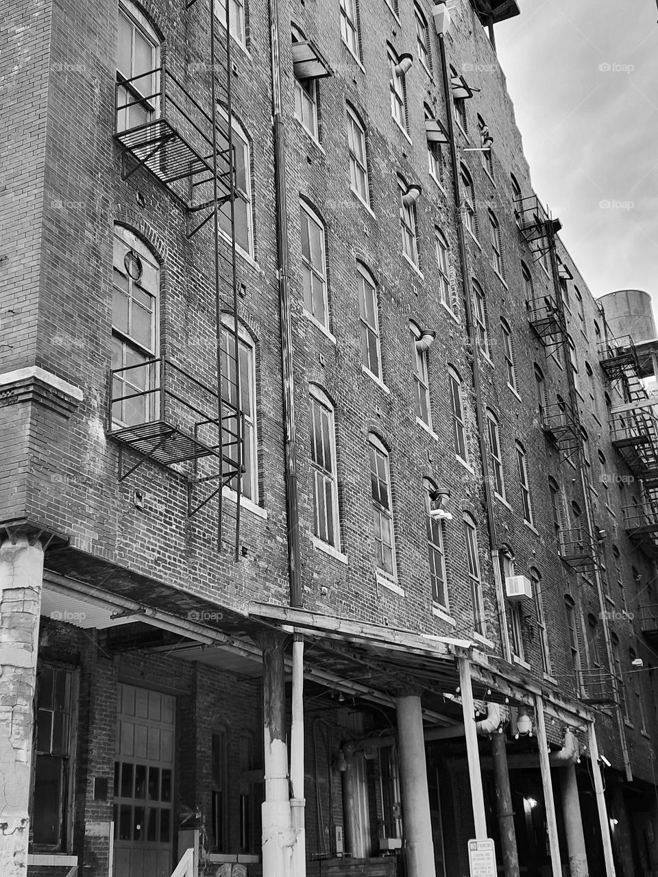 A typical large box type building constructed early to mid-century for lower income housing lacks style but has held up fairly well to years of harsh weather extremes