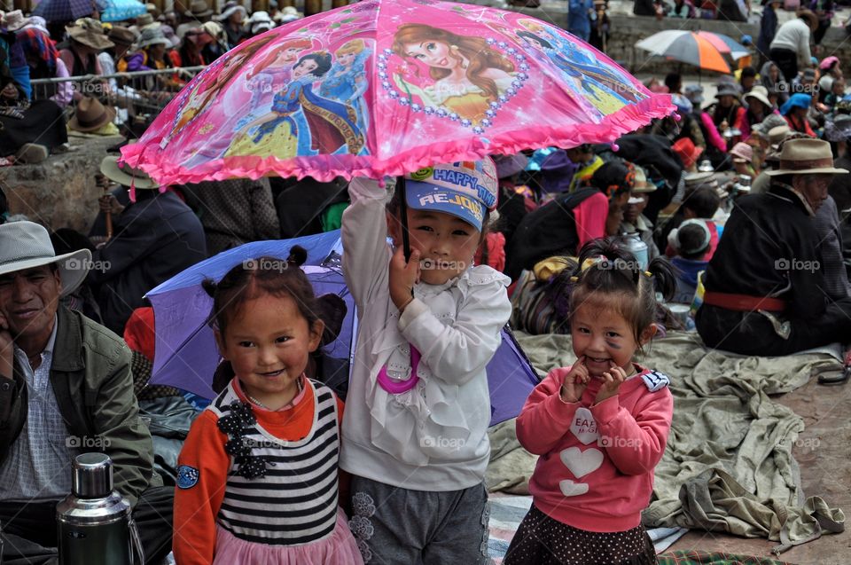 little girls in the yard of buddhist monastery in shigatse