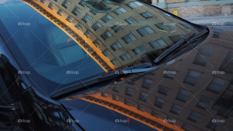 Building reflection on car windshield 