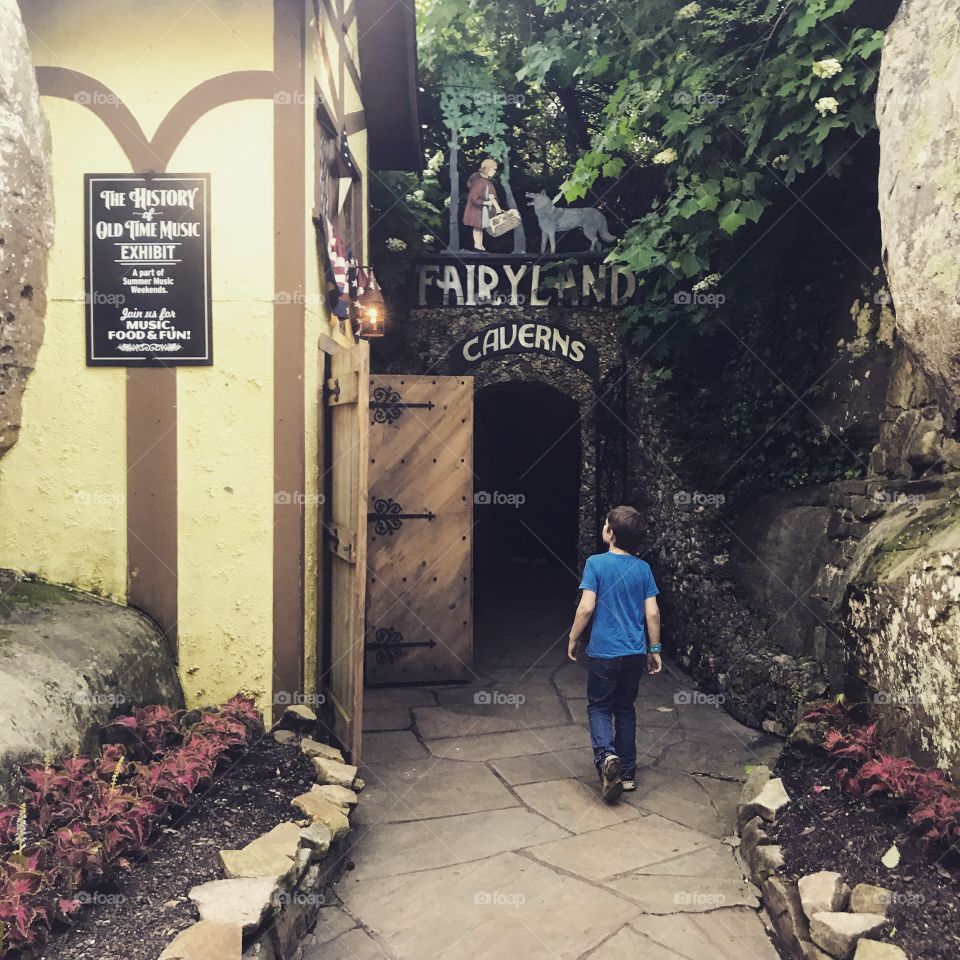 Boy walking through Rock City. Lookout Mountain, Tennessee