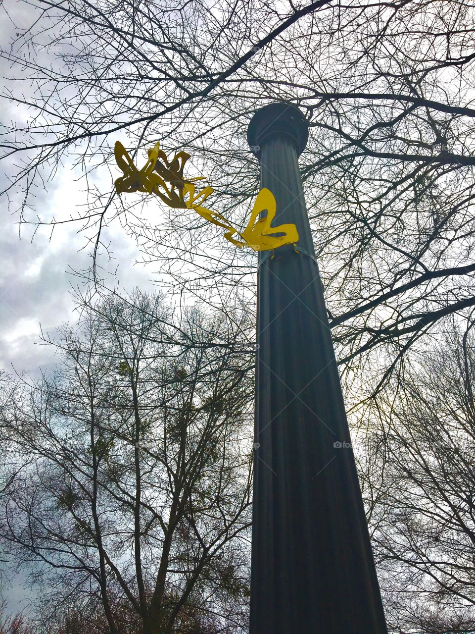 Light post with butterfly decoration 